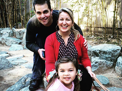 Brigette hiking with her husband, Steven Davis, and daughter, Kira